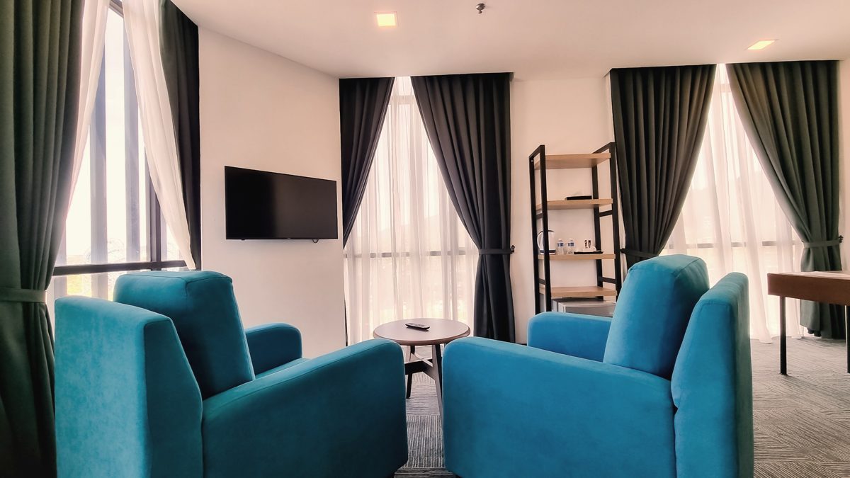 Suite Room lounge area with tall windows