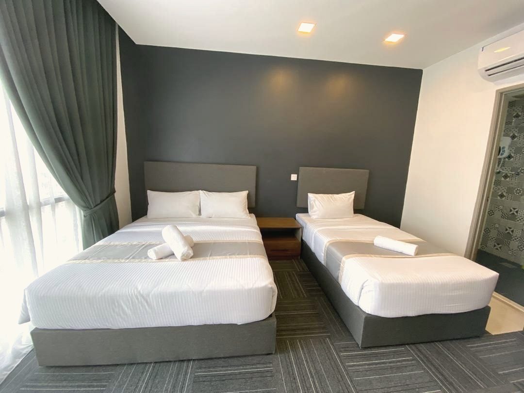 Triple Family Room with a queen bed and a single bed
